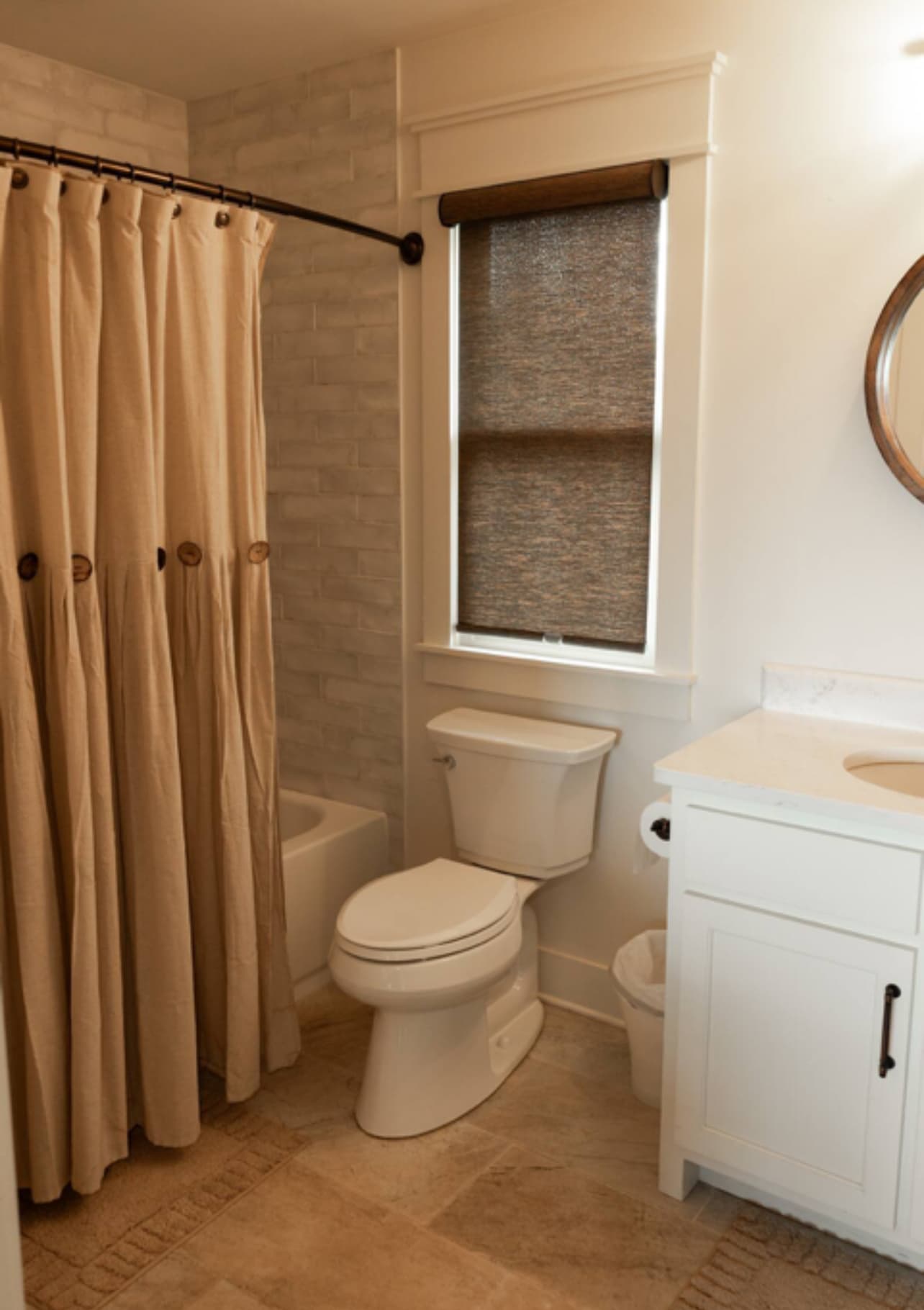 Bathroom with tub shower combination and neutral decor