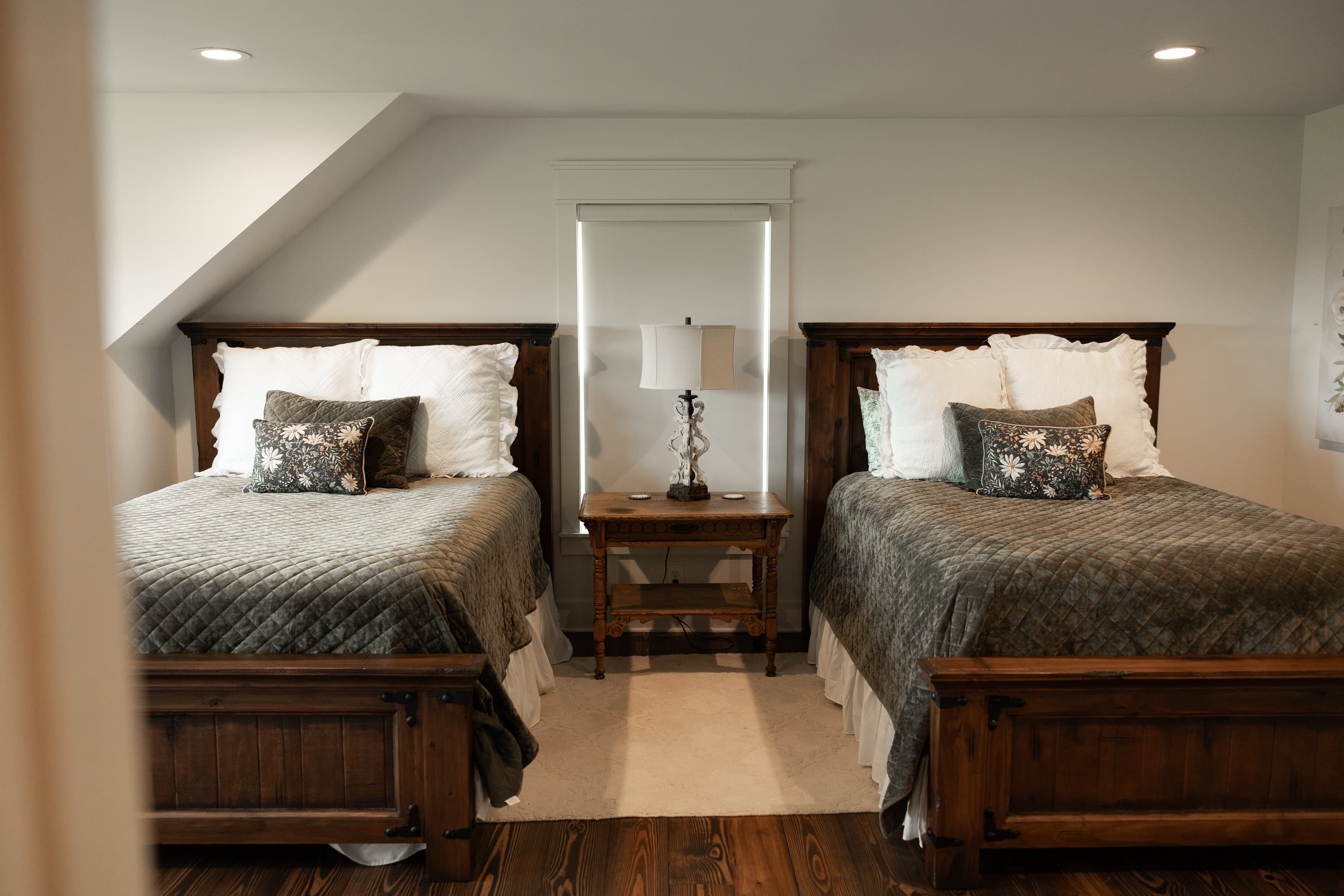 Bedroom with 2 green queen beds