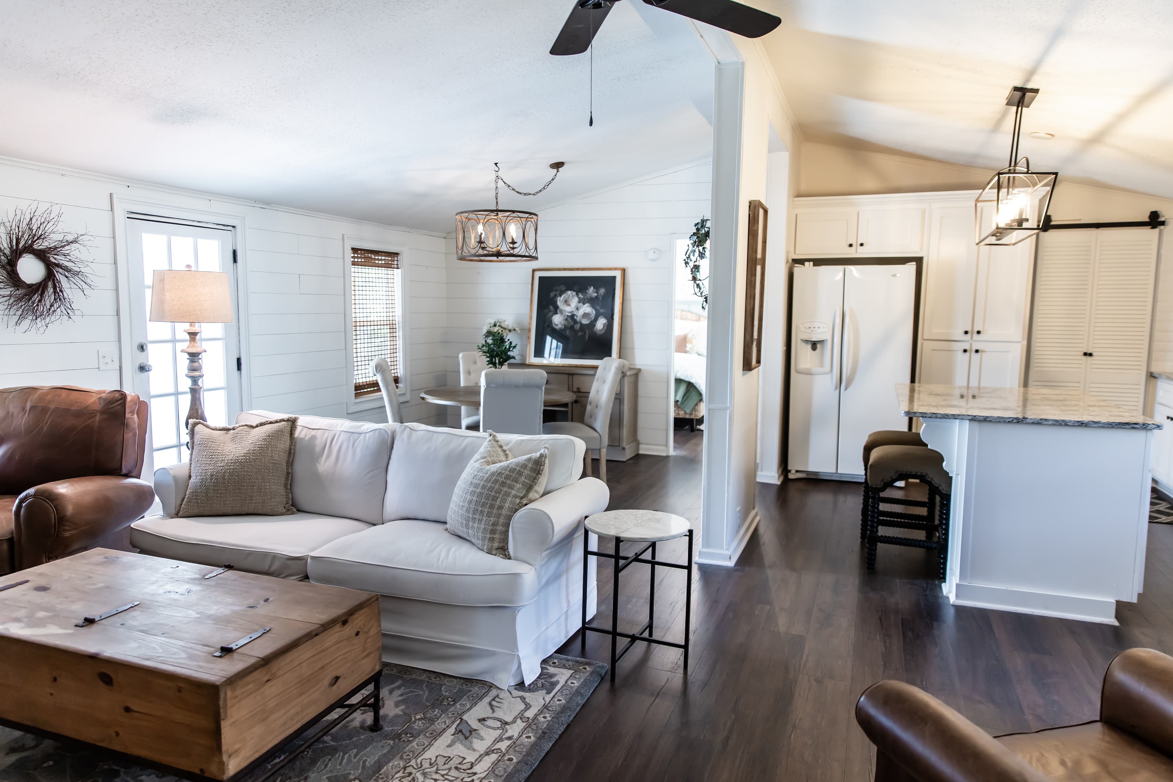 Open concept living room, dining room and kitchen with farmhouse decor