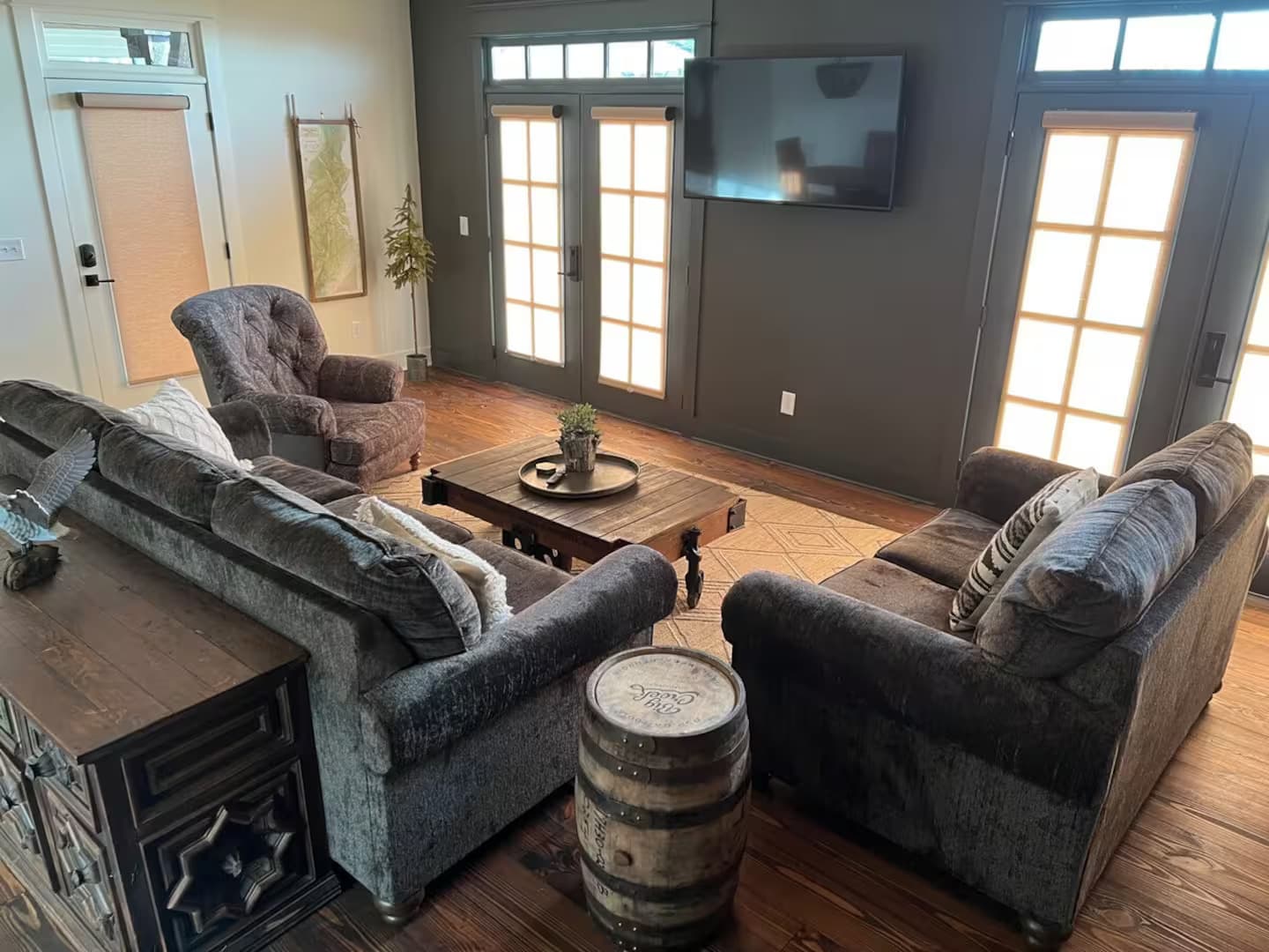 Family room with large sofa loveseat and chair with television